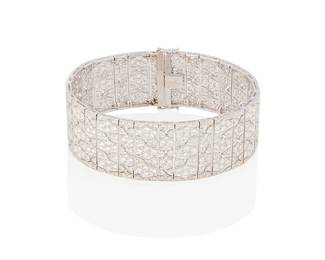165
A Diamond Bracelet
Set with 470 round brilliant-cut diamonds weighing approximately 10.50 carats, in 18K white gold.
42.10 grams
7" L x 3/4" W
Estimate: $6,000 - $8,000