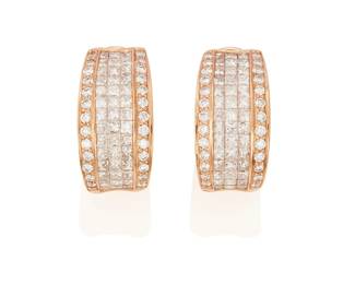 216
A Pair Of Diamond Earrings
Designed as half hoops featuring 84 princess-cut diamonds in concealed settings, further highlighted with 52 round brilliant-cut diamonds weighing a total of approximately 1.26 carats, in 14K rose gold.
2 pieces
8.30 grams
1 1/2" L x 3/8" W
Estimate: $600 - $800
