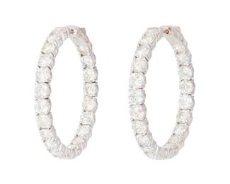 196
A Pair Of Diamond And Gold Earrings
The hoop earrings feature 42 round diamonds weighing 12.80 carats, set in 14K white gold.
2 pieces
9.32 grams
1 1/4" Dia.
Estimate: $4,000 - $6,000