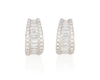 95
A Pair Of Diamond And Gold Earrings
Set with 20 graduating baguette-cut diamonds weighing a total of .91 carat, further accented with 48 round brilliant-cut diamonds weighing .29 carat, mounted in 18K white gold.
2 pieces
4.90 grams
1/2" L x 1/4" W
Estimate: $2,000 - $3,000