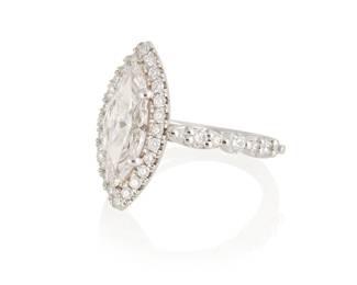 57
A Diamond And Platinum Ring
The ring features a marquise-shaped diamond weighing 2.00 carats, accented by 38 round brilliant-cut diamonds weighing .77 carat, set in platinum.

Accompanied by GIA report number 14503991 stating that the marquise-shaped diamond is I color, VVS1 clarity.
8.8 grams
Size: 6.25
Estimate: $12,000 - $15,000