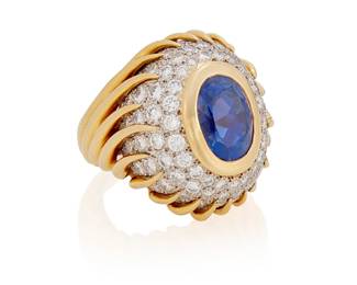 152
A Sapphire, Diamond, Platinum And Gold Ring, Verdura
Centering an oval-shaped sapphire measuring approximately 10.9 x 7.9 x 8.13 mm and weighing approximately 5.60 carats, within a frame of 65 round brilliant-cut diamonds weighing approximately .90 carat, set in platinum and 18K gold, signed Verdura.
Accompanied by a signed leather Verdura box.

Accompanied by AGL report number 1135847 stating that the sapphire is of Ceylon origin, with no gemological evidence of heat.
21.8 grams
Size: 6.75 (with internal ring stabilizer which can be removed)
Estimate: $8,000 - $12,000