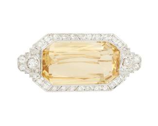 32
An Art Deco Citrine And Diamond Brooch
Centering rectangular-cut citrine quartz measuring approximately 19.63 x 35 x 12.83 mm and weighing approximately 60.12 carats, further accented by 40 old European-cut diamonds weighing approximately 2.60 carats, circa 1930.
25.78 grams
2 1/4" L x 1 1/8" W
Estimate: $2,500 - $3,500