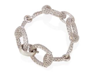 2
A Sterling Silver Bracelet, Gucci
Designed as a series of textured openwork horsebit links in sterling silver, signed Gucci.
52.56 grams
7" L
Estimate: $200 - $300