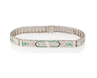 65
An Art Deco Emerald, Onyx, Diamond And Platinum Bracelet
Set at the center with a marquise-shaped diamond weighing approximately .33 carat, two marquise- shaped diamonds weighing approximately .50 carat, two triangular-cut diamonds weighing approximately .40 carat, 54 old European-cut diamonds weighing approximately 2.70 carats, 50 single-cut diamonds weighing approximately .50 carat, and two triangular-cut diamonds weighing approximately .40 carat, further accented by baguette and square-shaped emeralds and baguett-shaped onyx, set in platinum. Total weight of diamonds is approximately 4.43 carats.
22.82 grams
7 1/4" L x 1/4" W
Estimate: $6,500 - $8,500