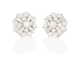 43
A Pair Of Diamond Snowflake Earrings
Set with 26 round brilliant-cut diamonds weighing 1.19 carats and 8 baguette-shaped diamonds weighing .51 carat, set in 18K white gold.
5.5 grams
1/4" Dia.
Estimate: $2,000 - $3,000