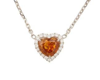 176
A Colored Diamond Pendant Necklace
Featuring a heart-shaped fancy deep yellowish orange diamond measuring 5.25 x 5.95 x 3.34 mm and weighing .68 carat, accented with round brilliant cut diamonds weighing approximately .24 carat, set in 18K white gold.

The diamond is accompanied by GIA report number: 2181391677 stating that the heart-shaped diamond is Fancy Deep Yellowish Orange, Natural Color.
2.9 grams
Length: 16 inches
Estimate: $4,000 - $6,000