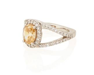 88
A Colored Diamond Ring
Set with an oval-shaped brownish yellow diamond measuring approximately 8.40 x 6.26 x 3.50 mm and weighing approximately 1.20 carats, and 42 round brilliant-cut diamonds weighing approximately .65 carat, mounted in platinum.
9.27 grams
Size: 6
Estimate: $3,000 - $5,000