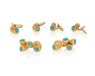183
A Turquoise And Gold Dress Set
The set comprising a pair of double sided cufflinks designed as intertwined fluted shells, each shell set with small cabochon turquoise, along with four similarly designed studs, in 18K gold.
6 pieces
32.7 grams
Cuff links: 1 1/8" L x 1/2" W; Studs: 3/8" x 1/4"
Estimate: $1,500 - $2,000