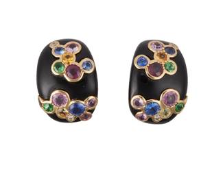 107
A Pair Of Colored Stone Diamond Earrings.
Set with circular-cut multi-colored sapphires, tsavorite garnets, and diamonds, mounted in 18K gold over black onyx.
7.8 grams
3/4" L x 1/2" W
Estimate: $1,000 - $1,500