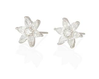 47
A Pair Of Diamond And Platinum Earrings
Designed as flowers set with 12 pear-shaped diamonds weighing a total of 2.83 carats, centered by 2 round brilliant-cut diamond stamens weighing a total of .25 carat, set in platinum.
2 pieces
5.50 grams
1/2" Dia.
Estimate: $3,500 - $5,500