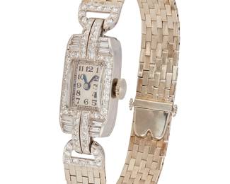 119
A Ladies Platinum And Diamond Wristwatch, Movado
Serial: 38160
Dial: Silver tone with Arabic numerals and tapered hands
Movement: 17-jewel
Case: 22 x 13 mm rectangular platinum case and set with baguette and single-cut diamonds estimated 1.00 carat total diamond weight.
Bracelet: platinum Brick link bracelet with box clasp, 7" L
28.61 grams
Estimate: $1,200 - $1,800