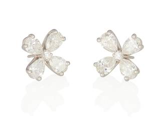 56
A Pair Of Diamond Earrings
Set with 8 pear-shaped diamonds weighing a total of 4.36 carats, centered by 2 round brilliant-cut diamonds weighing .09 carat, mounted in platinum.

Accompanied by 8 GIA reports stating that the pear-shaped diamonds range from G to J color, VS1 to SI2 clarity.
2 pieces
8.90 grams
3/4" L x 1/2" W
Estimate: $8,000 - $12,000