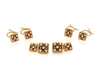 184
An Diamond And Enamel Dress Set
The dress set comprising a pair of double sided cufflinks and four studs set with 20 round brilliant-cut diamonds weighing a total of approximately .75 carat, set against a background of black enamel, in 18K gold, stamped 1-30 and 40 D
6 pieces
23.41 grams.
Cuff links: 1/2" H x 1/2" W / Studs: 3/8" H x 3/8" W
Estimate: $1,800 - $2,200