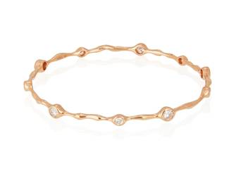 202
A Diamond Bangle
With 10 collet-set round brilliant-cut diamonds weighing 1.50 carats, mounted in 18K gold.
13.1 grams
2 1/2" D
Estimate: $2,000 - $3,000