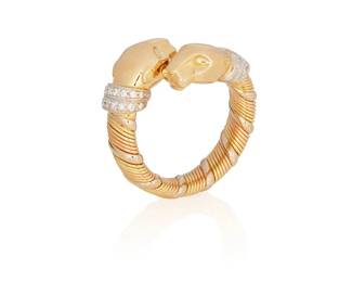 217
A Diamond And Gold Ring, Cartier
The bypass style ring features panther head terminals highlighted by diamond-set collars, completed by a twisted gold shank, signed Cartier with serial numbers.
11.30 grams
Size: 5.5
Estimate: $1,200 - $1,800