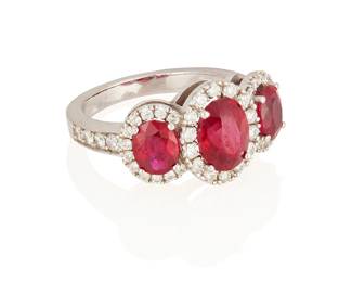 53
A Ruby, Diamond And Gold Ring
Centering an oval-shaped ruby measuring approximately 9.18 x 7.27 x 4.57 mm and weighing approximately 2.01 carats, highlighted on either side with two oval-shaped rubies weighing approximately .73 carat and .71 carat, further accented with 46 round brilliant-cut diamonds weighing approximately .84 carat, in 18K white gold.
7.40 grams
Size: 6.5
Estimate: $3,000 - $5,000