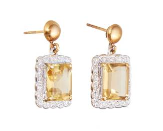 31
A Pair Of Citrine And Diamond Earrings
Each set with a rectangular-cut citrine weighing approximately 4.96 carats and 4.81 carats, accented by 32 round brilliant-cut diamonds weighing approximately 0.32 carat, suspended from a round gold stud, mounted in 14K yellow and white gold.
2 pieces
8.12 grams
3/4" L x 1/2" W
Estimate: $900 - $1,200