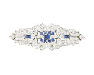 172
An Art Deco Sapphire And Diamond Double-Clip Brooch
The brooch set with with 86 round brilliant-cut diamonds, 8 baguette-cut diamonds, and 2 marquise-shaped diamonds weighing a total of approximately 6.22 carats, further accented with 16 baguette cut sapphires weighing a total of approximately 0.75 carat, in platinum, the clips mounted on a removeable white gold frame to be worn as two separate brooches, circa 1925.
19.13 grams
3/4" H x 2 1/2" W
Estimate: $5,000 - $7,000