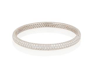 91
A Diamond Bangle
The bangle features 265 pavé-set round brilliant-cut diamonds weighing 7.37 carats, set in 18K white gold.
18.8 grams
2 3/5" D
Estimate: $6,000 - $8,000