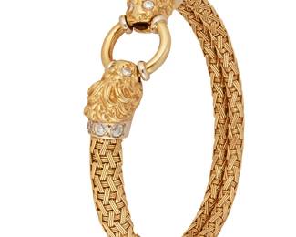 20
A Diamond And Gold Bracelet
The woven gold bracelet features two lion's head terminals grasping a ring, set with 14 round brilliant-cut diamonds weighing a total of approximately .80 carat, in 18K gold, marked Italy.
46.12 grams
7 3/4" L
Estimate: $1,800 - $2,200