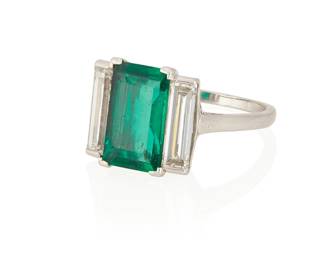 49
An Emerald, Diamond, And Platinum Ring
Centering a rectangular-cut emerald measuring approximately 12.10 x 7.45 x 3.75 mm. and weighing approximately 2.42 carats, flanked by two rectangular-cut diamonds weighing a total of approximately 1.50 carats, set in platinum.

Accompanied by AGL report number 1136297 stating that the emerald is of Colombian origin, with insignificant traditional clarity enhancement.
5.8 grams
Size: 7
Estimate: $30,000 - $50,000