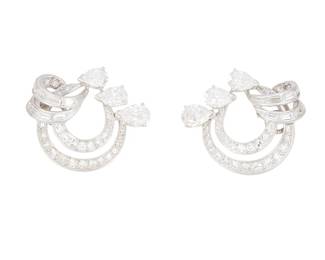 223
A Pair Of Diamond Earrings
The earrings feature 40 single-cut, 6 pear-shaped and 16 baguette-cut diamonds weighing approximately 3.06 carats, set in platinum.
2 Pieces
7.9 grams
1" L x 7/16" W
Estimate: $1,000 - $2,000