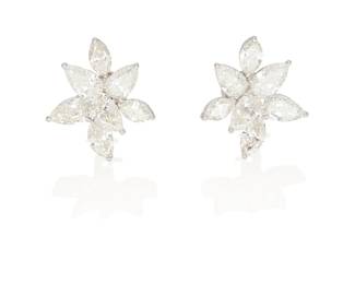 70
A Pair Of Diamond Cluster Earrings
The earrings feature 6 marquise-shaped diamonds weighing 3.47 carats and 8 pear-shaped diamonds weighing 7.22 carats, set in platinum.

Accompanied by 6 GIA reports stating that the marquise-shaped diamonds range from H to J color, VS1 to VS2 clarity.
Accompanied by 8 GIA reports stating that the pear-shaped diamonds range from G to I color, SI1 to SI2 clarity.
2 pieces.
12.70 grams.
1" L x 3/4" W
Estimate: $25,000 - $35,000