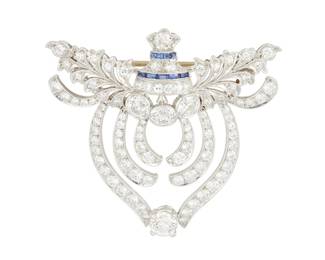 171
An Antique Diamond And Synthetic Sapphire Brooch
The brooch features an old European-cut diamond weighing approximately .60 carat, three old European-cut diamonds weighing a total of approximately 1.50 carats, further accented by 61 old European-cut diamonds weighing a total of approximately 2.00 carats, highlighted by channel set synthetic sapphires, set in platinum, circa 1915
12.8 grams
1 3/4" H x 1 1/2" W
Estimate: $1,000 - $2,000