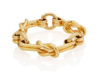79
A Gold Bracelet
The bracelet is designed as a series of gold knots and circular links, in 18K gold.
126.20 grams
7 1/2" L
Estimate: $5,500 - $7,500