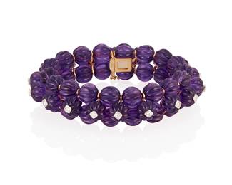 25
An Amethyst And Diamond Bracelet
Comprised of 54 fluted amethyst beads accented by 20 round brilliant-cut diamonds weighing .88 carat, mounted in 18K gold.
66 grams
7 1/4" L
Estimate: $4,500 - $6,500