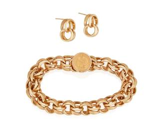 29
A Set Of Gold Jewelry
The set comprises a fancy link bracelet featuring a Mexican coin clasp, along with a similar pair of earrings in 14K yellow gold.
3 pieces
70.80 grams
Bracelet 7 3/4" x 1/2" Earrings 1/2" L x 1/8" W
Estimate: $1,200 - $1,800