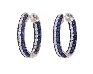 163
A Pair Of Sapphire And Diamond Earrings
Set with 92 circular-cut sapphires weighing 1.23 carats and 48 round brilliant-cut diamonds weighing .53 carat, mounted in 18K white gold.
2 pieces
5.20 grams
1/2" L x 1/2" W
Estimate: $1,500 - $2,000