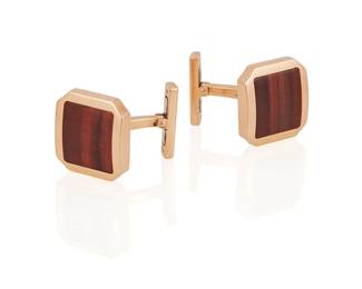 12
A Pair Of Tiger's Eye Cufflinks, Cartier
Each set with a square-shaped tiger's eye quartz, in 18K rose gold, signed Cartier.
2 pieces
7.6 grams
1/2" H x 1/2" W
Estimate: $600 - $800
