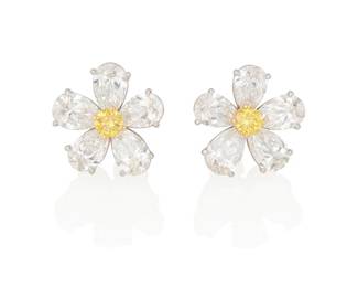 61
A Pair Of Colored Diamond And Diamond Earrings, Bulgari
Centering a round brilliant-cut fancy vivid yellow diamond weighing .17 carat and a round brilliant-cut fancy vivid orangy yellow diamond weighing .17 carat, surrounded by 10 pear-shaped diamonds weighing a total of 4.42 carats, in platinum, signed Bulgari.

Accompanied by GIA report number 5212138437 stating that the .17 carat diamond is Fancy Vivid Yellow, Natural Color.
Accompanied by GIA report number 1216138436 is Fancy Vivid Orangy Yellow, Natural Color.
Accompanied by 10 GIA reports stating that the pear-shaped diamonds range from .40 to .49 carat, and are E to G color, VS1 to SI1 clarity.
2 pieces
5.80 grams
1/2" Dia.
Estimate: $12,000 - $18,000