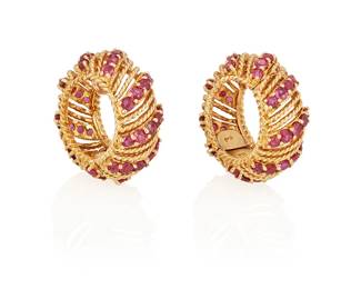 112
A Pair Of Gold And Ruby Earrings
The earrings are designed as clip-on hoops set with 90 circular-cut rubies weighing a total of approximately 6.30 carats, in 14K gold.
2 pieces
34.49 grams
1 1/8" L x 1/2" W
Estimate: $1,500 - $2,000