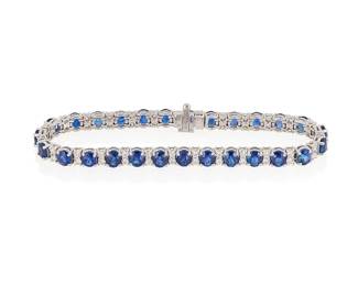 198
A Sapphire And Diamond, Line Bracelet
Set with 27 oval-shaped sapphires weighing 13.08 carats and 54 round brilliant-cut diamonds weighing 2.10 carats, mounted in 18K white gold.
20.3 grams
7" L
Estimate: $6,000 - $8,000