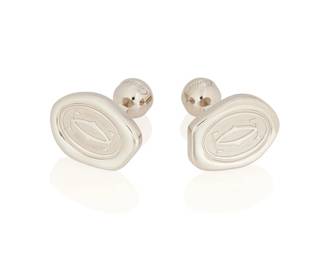 11
A Pair Of Gold Cufflinks, Cartier
Designed with interlocked double C's, in 18K white gold, signed Cartier
2 pieces
25 grams
3/4" H x 1/2" W
Estimate: $600 - $800