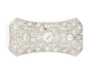 170
An Antique Diamond And Platinum Brooch-Pendant
Centering an old European-cut diamond weighing approximately .70 carat, surrounded by 12 old European-cut diamonds weighing approximately .90 carat, in a filigreed platinum mounting with a fold down pendant mechanism.
10.30 grams
3/4" L x 1 1/2" W
Estimate: $1,500 - $2,000