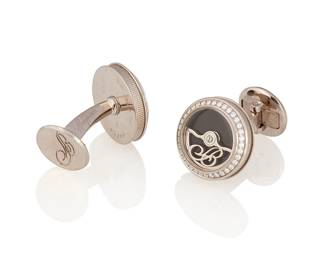 7
A Pair Of Diamond And Gold 'Rotor' Cufflinks, Breguet
The cufflinks are designed with oscillating weights over onyx dials, highlighted with diamond set bezels and fluted case bands, in 18K white gold, signed Breguet.
2 pieces
19 grams
Cuff links: 1/2" dia.
Estimate: $600 - $800