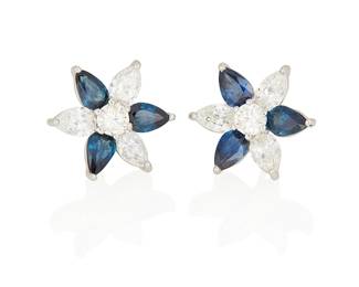 72
A Pair Of Sapphire, Diamond And Platinum Earrings
Set with 6 pear-shaped diamonds weighing 1.98 carats alternating with 6 pear-shaped sapphires weighing 3.04 carats, centered by 2 round brilliant-cut diamonds weighing .60 carat, mounted in platinum.
2 pieces
3.70 grams
5/8" Dia.
Estimate: $4,000 - $6,000