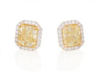 192
A Pair Of Colored Diamond And Gold Earrings
Set with a pair of radiant-cut fancy intense yellow diamonds weighing 1.55 and 1.50 carats, surrounded by 40 round brilliant-cut diamonds weighing approximately a total of .40 carat, set in 18K white and yellow gold.

Accompanied by GIA report numbers 6193483196 and 2223194987 stating that the diamonds weighing 1.50 and 1.55 carats are Fancy Intense Yellow, Natural Color, Internally Flawless and VVS2 clarity.
2 pieces
4.87 grams
3/8 inch x 3/8 inch
Estimate: $20,000 - $25,000