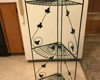 Folding corner shelf, so dark green it looks black!