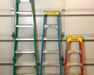 JOSW216 Three Werner Ladders A trio of Werner ladders. Green ladder is a 8ft ladder, blue ladder is 6ft and the orange laddder is a 4ft one. All looking to be in a good condition.