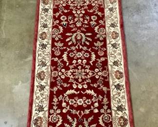 JOSW217 Kenneth Mink, Wool Runner Has flower design around the boarder, comes with a protective pad for underneath the runner. Looks to be in a good condition.