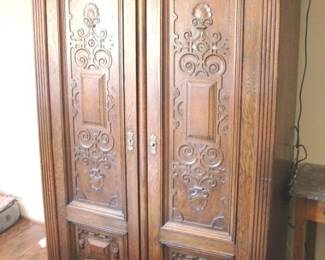 605 - Intricately carved double door linen press Vintage 76 x 47.5 x 20
