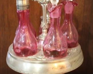 775 - Cranberry glass castor set, 14.5"
