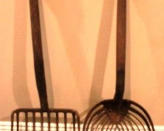 437 - Antique Farm Tools (2) 41 Inches Tall
