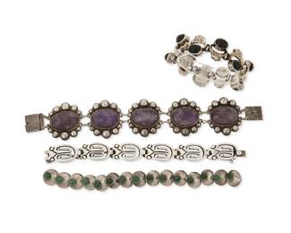 2233
A Group Of Mexican Silver Bracelets
Mid/late 20th century
Each stamped for silver and for Mexico; further variously stamped: JN JACOBO / 925 / Taxco / [Eagle 3] / 0.925 / [two trees cipher] / TS-30
Comprising a silver link bracelet with large amethyst cabochons (8.5" L x 1.5" H), a silver bracelet with small disc links each set with green stones (7" L x 0.625" H), a sterling silver and set onyx openwork link bracelet (6.5" L x 0.875" H), and a JN Jacobo (Jacopo) silver link bracelet with stylized owl motif links (7" L x 0.625" H), 4 pieces
193.8 grams gross
Estimate: $500 - $700
