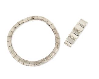 2162
A Group Of Antonio Pineda Mexican Silver Jewelry
Antonio Pineda (1919-2009)
Circa 1953-1979; Taxco, Mexico
Each with crown mark for Antonio Pineda; Eagle 17; further stamped: Silver / Hecho en Mexico / 970
Two works comprising a sterling silver necklace with rectangular concave links (17" L x 0.625" H) and a chunky sterling silver bracelet with square deeply concave links (7.25" L x 0.875" H), 2 pieces
248.0 grams
Estimate: $1,000 - $2,000